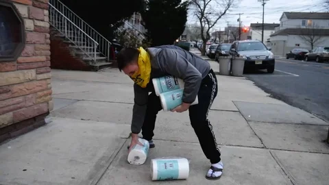 Dramatic Corona Virus Man Picking Up Paper Towels Stock Footage 127072622