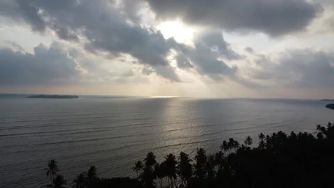 Dramatic Crepuscular Rays Over Sea and Island Coast Stock Footage 344038353