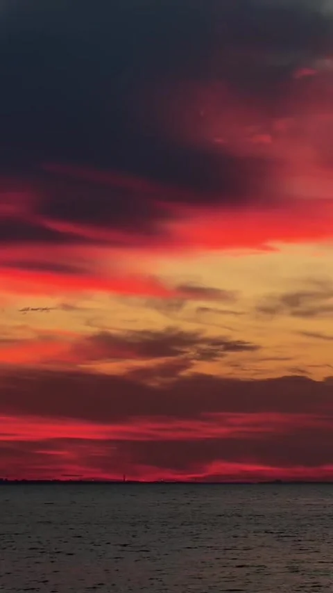 Dramatic Crimson and Fiery Orange Sunset Sky over Ocean Stock-Footage 339774638