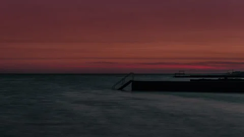 Dramatic Crimson Dusk Sky Over Ocean Pier At Twilight Stock Footage 341885422