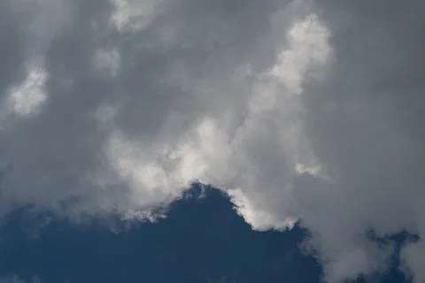 Dramatic cumulus cloud edge with sunlight contrast 写真素材