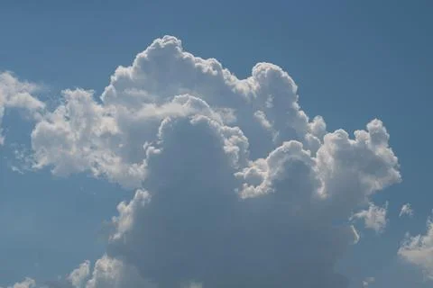 Dramatic cumulus cloud formation against blue sky Stock Photos