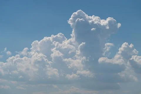 Dramatic cumulus cloud formation against blue sky 写真素材