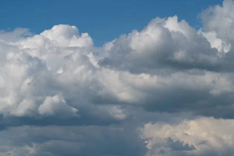Dramatic cumulus clouds against blue sky Photos