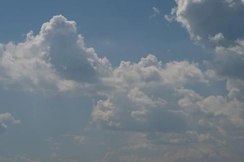 Dramatic cumulus clouds against a blue sky Stock Photos