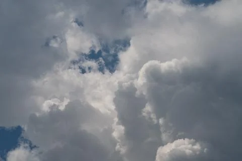 Dramatic cumulus clouds against a soft blue sky Stock Photos