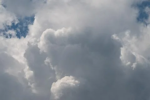 Dramatic cumulus clouds filling a blue sky Stock Photos