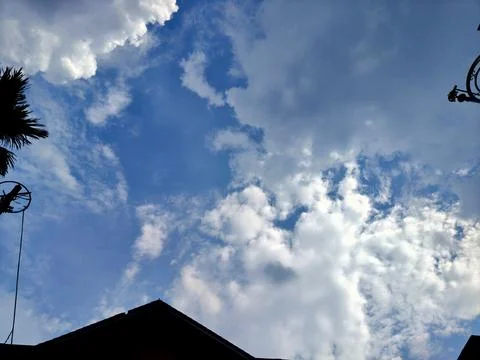 Dramatic cumulus clouds filling a bright blue sky Stock Photos