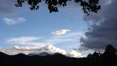 Dramatic Cumulus clouds form over snowcapped mountain Stock Footage 118733993