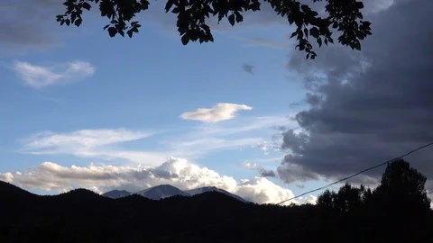 Dramatic Cumulus clouds form over snowcapped mountain Stock Footage 118735238