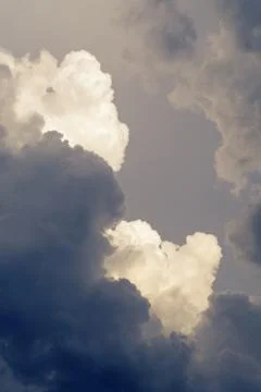 Dramatic cumulus clouds forming into violent thunderstorm Stock Photos