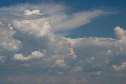 Dramatic cumulus clouds over a blue sky Stock Photos
