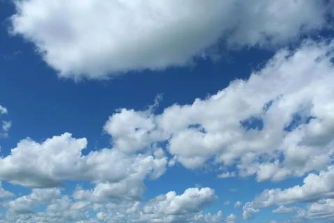 Dramatic Cumulus Clouds in Vibrant Blue Sky. Photos