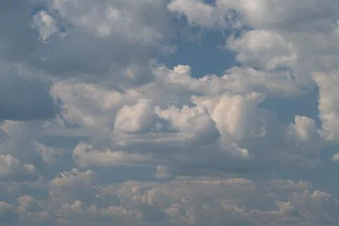 Dramatic cumulus cloudscape across a blue sky Stock Photos