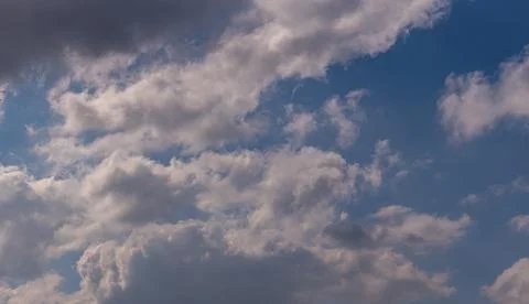 Dramatic Cumulus Cloudscape with Bright Sunlight and Blue Sky for Weather F.. 写真素材