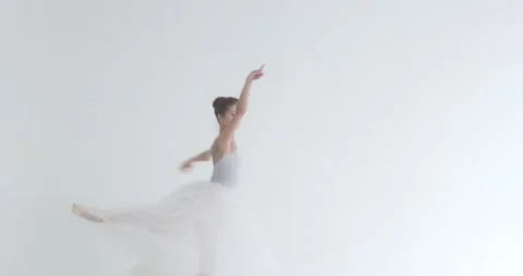 Dramatic dance, elegant female in a white tutu, dance ballet and perform Stock Footage 143376189