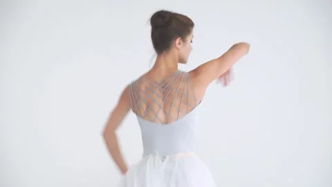 Dramatic dance, elegant female in a white tutu, dance ballet and perform Stock Footage 265839783