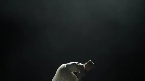 Dramatic dance, elegant woman in a white tutu, perform choreographic elements on Stock Footage 244914450