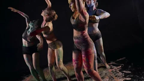 Dramatic dance of four women in paints, female bodies are covered by dyes Stock Footage 169698842