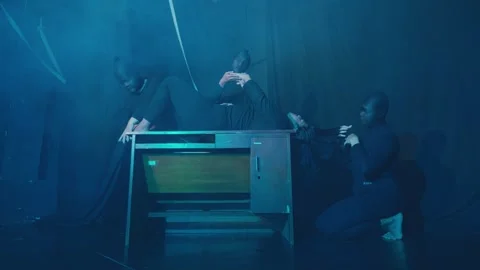 Dramatic Dance Performance with Smoke and Table Stock Footage 296545328