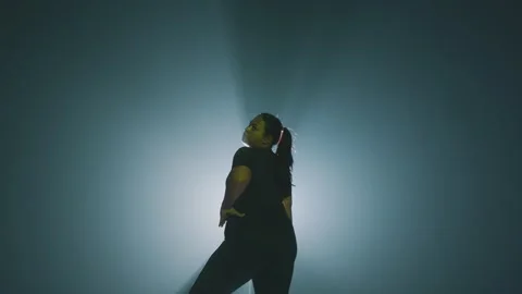 Dramatic Dancer Silhouette in Spotlight Stock Footage 296593131