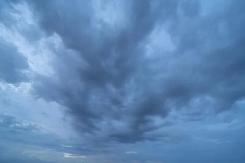 Dramatic dark blue clouds sky with thunder storm and rain at night. Abstract  Stock Photos