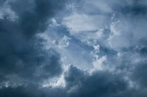 Dramatic dark blue sky with heavy clouds background. Foto stock