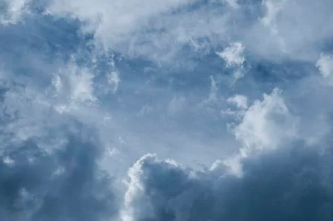 Dramatic dark blue sky with heavy clouds background. Foto stock