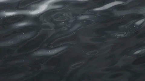 Dramatic dark blue water surface wave sun light vibrant glow closeup. Stormy Stock Footage 170161786