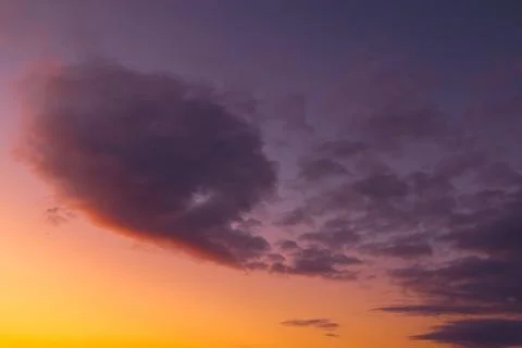 Dramatic Dark Cloud Against Purple Orange Sunset Sky Stock Photos