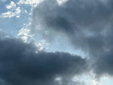 Dramatic Dark Clouds with Blue Sky Opening Stock Photos