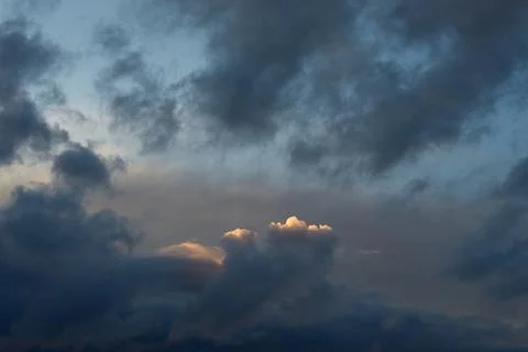 Dramatic dark clouds with light highlights. Fotos Stock