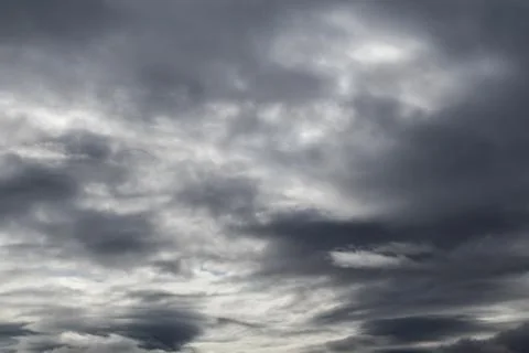 Dramatic dark clouds moody grey sky cloudscape Stock Photos