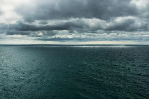 Dramatic dark clouds over the sea before the rain Stock Photos