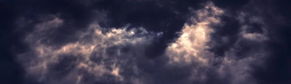 Dramatic dark clouds Stock Photos