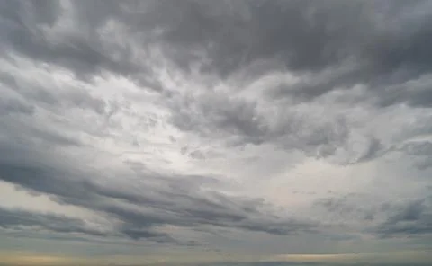 Dramatic dark clouds sky with thunder storm and rain at night. Abstract natur Stock Photos