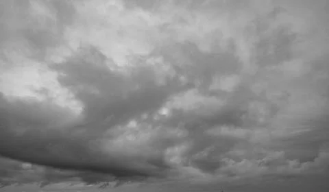 Dramatic dark clouds sky with thunder storm and rain. Abstract nature landsca Stock Photos