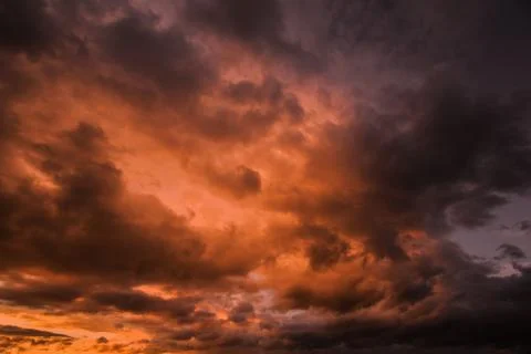 Dramatic Dark cloudy stormy sky in the evening Stock Photos