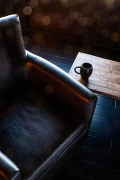 Dramatic dark lighting on comfortable office chair Stock Photos