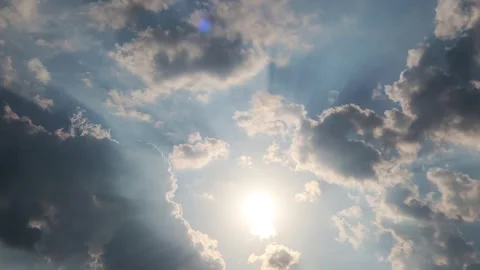 Dramatic dark rain storm cloud n bright sun light ray on clear blue sky Stock-Footage 330095593