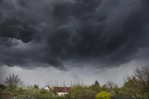 Dramatic dark sky and clouds background. Black sky before thunder storm and.. Stock Photos