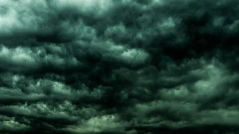 Dramatic dark sky and clouds. Cloudy sky background. Black sky before thund.. Stockfoto's