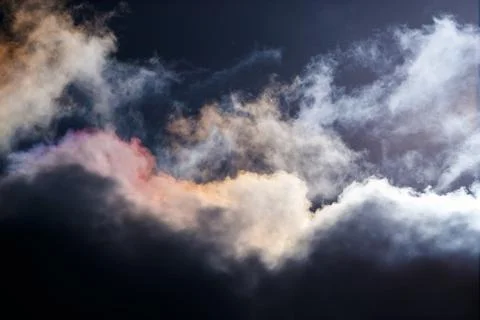 Dramatic Dark Sky with Iridescent Cloud Edges Stock Photos