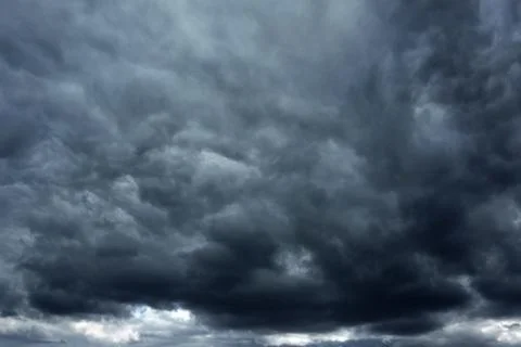 Dramatic dark sky with storm cloud before thunder storm Stock Photos