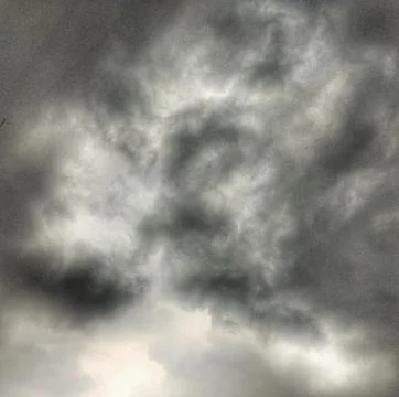 Dramatic Dark Storm Clouds and Overcast Sky Before Heavy Rain Stock Photos