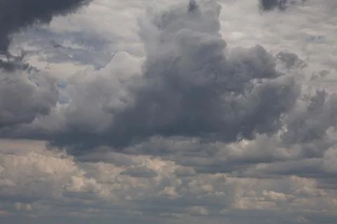 Dramatic dark storm clouds gathering in the sky overhead Stock Photos