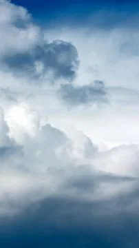 Dramatic dark storm clouds gathering in the sky creating an abstract full f.. Stock Photos