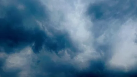 Dramatic Dark Storm Clouds in Moody Blue Sky Before Heavy Rain. Stock Photos