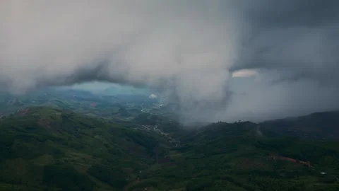 Dramatic dark storm clouds moving fast across the sky. Rolling puffy cumulus Stock Footage 317839377