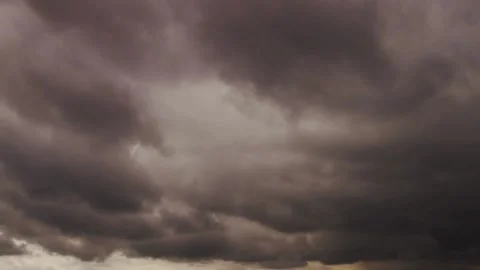 Dramatic dark storm clouds moving moody atmospheric cloudscape Stock Footage 329543906